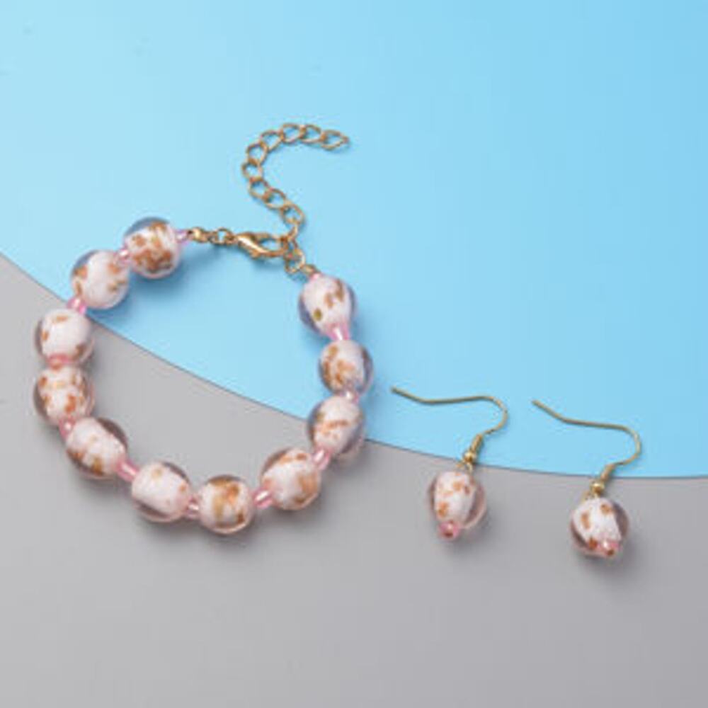 NWOT Pink Colored Glass Adjustable Bracelet and Earrings in Goldtone